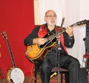 John Stuart, playing guitar for Phoenix Dixieland Jazz Band at Farnborough Jazz Club on 19th August 2016. Photo by Mike Witt.