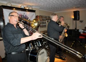 Dave Hewitt plays trombone, with Alan Gresty on trumpet and Al Nichols on tenor sax, front line of Tony Pitt's All Stars, seen here at Farnborough Jazz Club for Keith's birthday on 12th August 2016. Photo by Mike Witt.