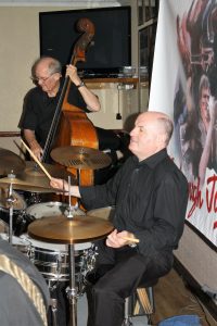 Andy Lawrence (d'bass) and John Ellmer (drums) play for (jazz co-promoter) Keith Grant's birthday at Farnborough Jazz Club with Tony Pitt's All Stars on 12th August 2016. Photo by Mike Witt (also b'day a boy)