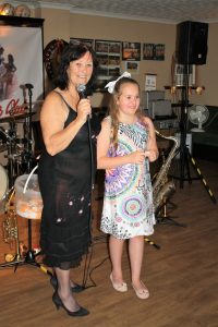 My granddaughter Zianna, joins me with the raffle draw at Farnborough Jazz Club with Tony Pitt's All Stars on Keith's birthday, 12th August 2016. Photo by Mike Witt (also a b'day boy)..