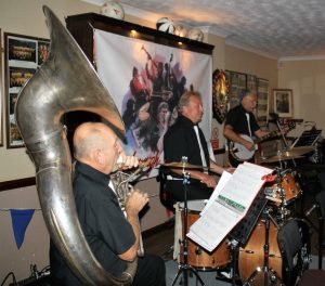 'Battle of Britain' Annivertsary celebrations with The Fenny Stompers at Farnborough Jazz Club,  Kent.  (LtoR) The 'engine'  boys, being Dave Arnold on Sousaphone, Ken Joiner on drums and Brian Vick on banjo. Photo by Mike Witt.