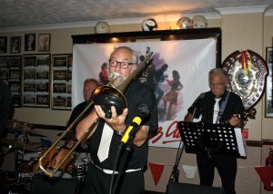 John Lee on trombone, with Ken Joiner on drums and Brian Vick on banjo, members of The Fenny Stompers at Farnborough Jazz Club's 'Battle of Britain' Anniversary fancy dress party on 16th September 2016. Photo by Mike Witt.