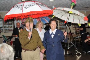 Steve and Diane take part in the brolly parade to 'Bourbon Street Parade' by The Fenny Stompers Jazz Band at Farnborough Jazz Club's 'Battle of Britain' Anniversary fancy dress party on 16th September 2016. Photo by Mike Witt.